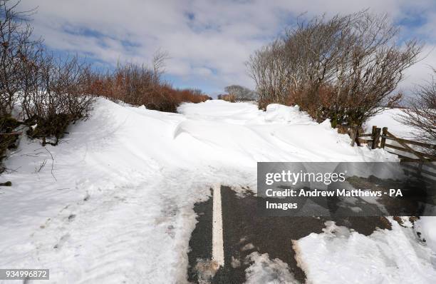 Drifted snow blocks a road heading out of Simonsbath in Exmoor National park, as the icy conditions brought by the &quot;Mini Beast from the...