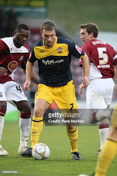 Rickie Lambert of Southampton controls the ball watched by Patrick Kanyuka of Northampton Town during the FA Cup sponsored by e.on Second Round Match...