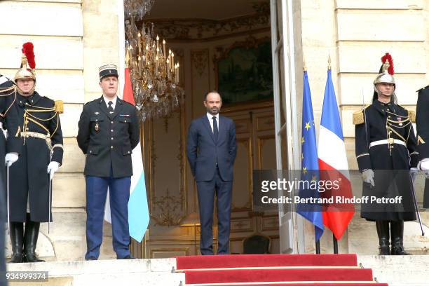 French Prime Minister Edouard Philippe waits for Grand-Duc Henri and Grande-Duchesse Maria Teresa of Luxembourg at "Hotel de Matignon" during their...