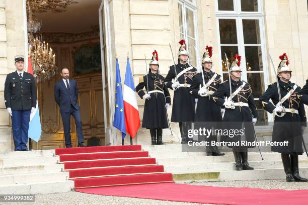 French Prime Minister Edouard Philippe waits for Grand-Duc Henri and Grande-Duchesse Maria Teresa of Luxembourg at "Hotel de Matignon" during their...