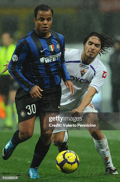 Amantino Mancini of FC Internazionale is challenged by Juan Manuel Vargas during the Serie A match between Inter Milan and Fiorentina at Stadio...