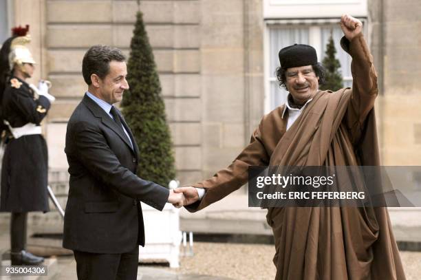 French president Nicolas Sarkozy welcomes Libyan leader Moamer Kadhafi 10 December 2007 at the French Elysee Palace in Paris. A tent for Kadhafi has...