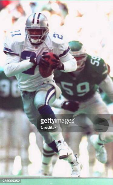 Dallas Cowboys wide-receiver Deion Sanders runs for a first half touchdown 07 January in the NFC Divisional play-off game against the Philadelphia...