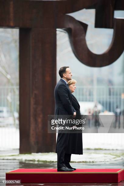 German Chancellor Angela Merkel and Irish Prime Minister Leo Varadkar listen to the national anthems at the Chancellery in Berlin, Germany on March...