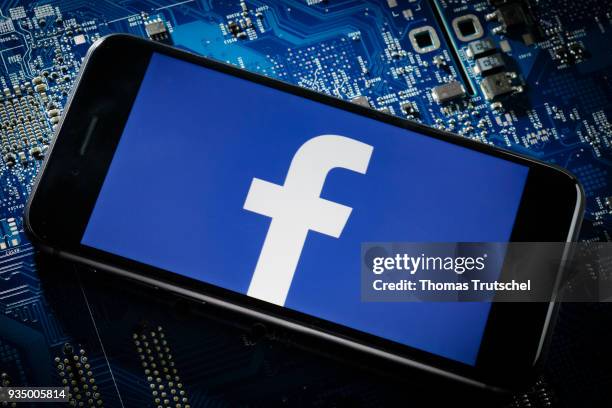 Berlin, Germany In this photo illustration the logo of Facebook is displayed on a smartphone which is lying on a circuit board on March 20, 2018 in...