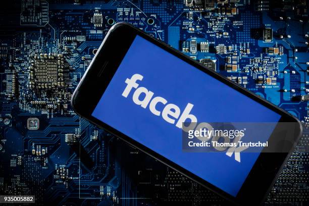 Berlin, Germany In this photo illustration the logo of Facebook is displayed on a smartphone which is lying on a circuit board on March 20, 2018 in...