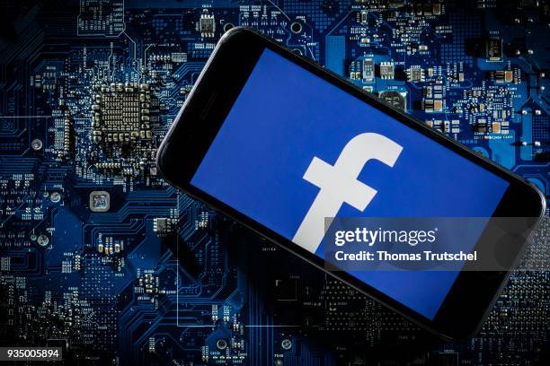 Berlin, Germany In this photo illustration the logo of Facebook is displayed on a smartphone which is lying on a circuit board on March 20, 2018 in...