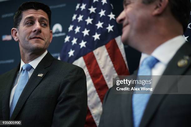 Speaker of the House Rep. Paul Ryan talks to Rep. Don Bacon during a news briefing after the weekly House Republican Conference meeting March 20,...