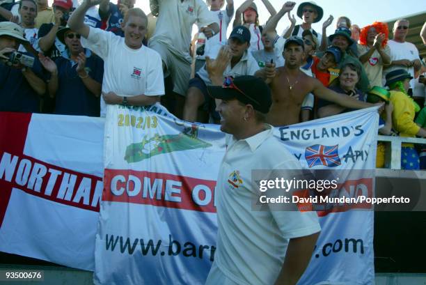 Australian bowler Shane Warne enjoys a lap of honour and some fun with England's Barmy Army after beating England on the third day of the 3rd Test...