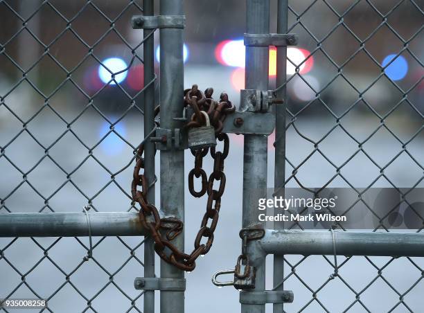 Gate is locked in front of Great Mills High School after a shooting on March 20, 2018 in Great Mills, Maryland. It was reported that two students at...