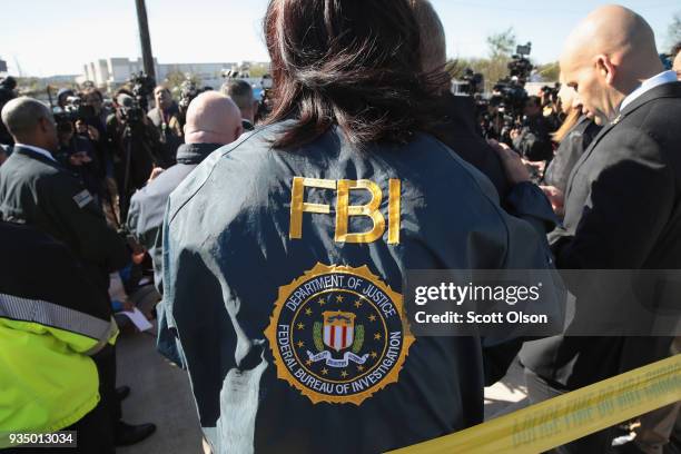 And ATF agents, and local officials update the media on their investigation outside a FedEx facility following an explosion on March 20, 2018 in...