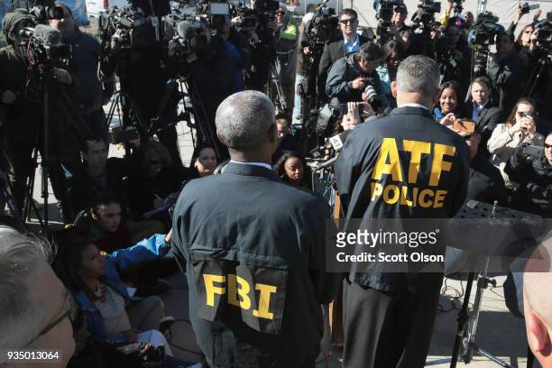 And ATF agents, and local officials update the media on their investigation outside a FedEx facility following an explosion on March 20, 2018 in...