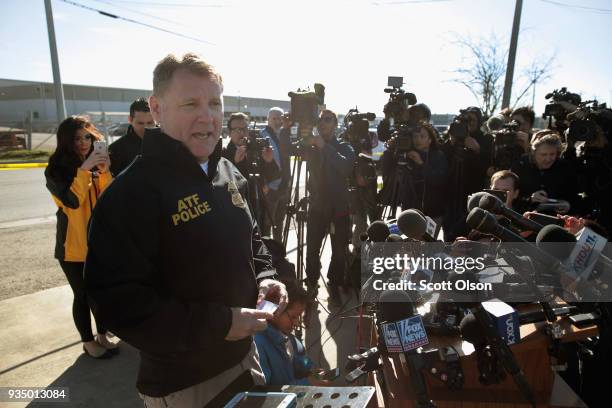Michael Knight, public information officer for ATF, speaks to the media gathered outside of a FedEx facility following an explosion on March 20, 2018...