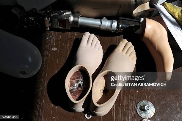 Prosthesis and a pair of orthoses lay on a table at the Colombian Centre for Integrated Rehabilitacion in Bogota on November 24, 2009. AFP...