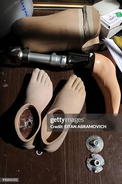 Prosthesis and orthoses lay on a table at the Colombian Centre for Integrated Rehabilitacion in Bogota on November 24, 2009. AFP PHOTO/Eitan...