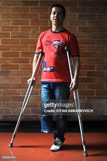 Humberto Jesus Guevara Trejos, a victim of a landmine explosion, poses at the Colombian Centre for Integrated Rehabilitacion in Bogota on November...