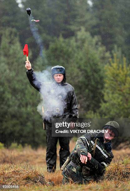 Belarussian soldier throws a dummy grenade during a training exercise 75 km north of Minsk near the town Borisov on November 18, 2009. NATO expressed...