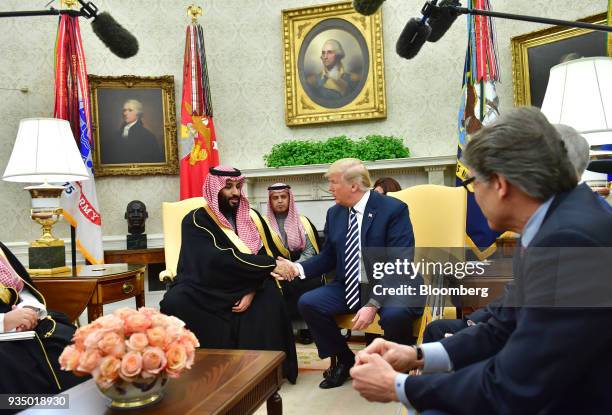Mohammed bin Salman, Saudi Arabia's crown prince, center left, shakes hands with U.S. President Donald Trump, center right, during a meeting in the...