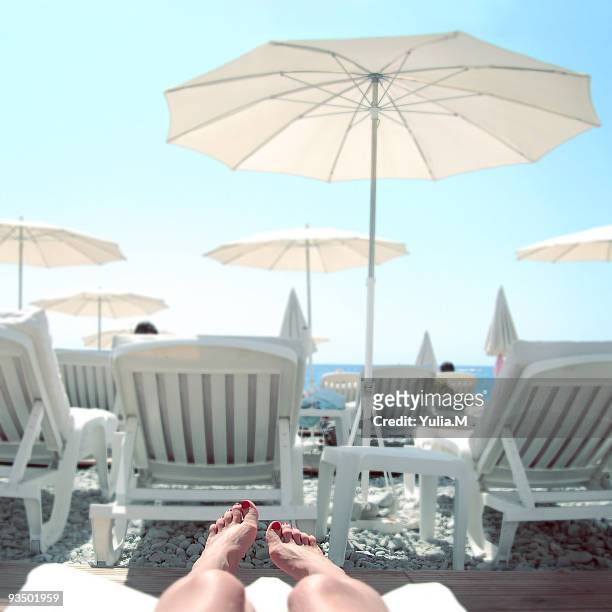 sunbathing looking out to sea - women with nice legs bildbanksfoton och bilder
