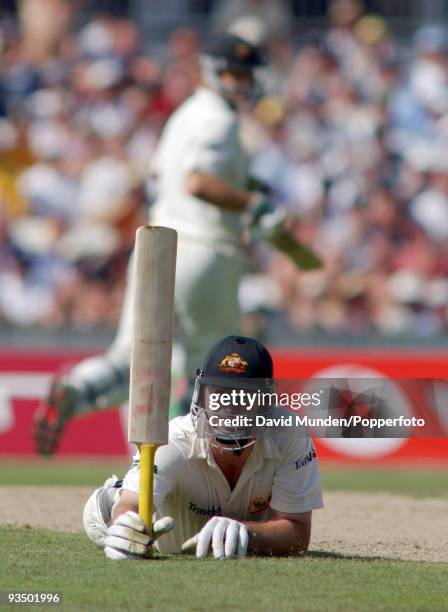 Australian captain Steve Waugh completes his century and, in spite of a crippling leg injury, goes on to make 157 not out in the first innings as...