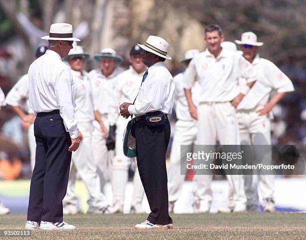 Umpires Rudi Koertzen and B.C.Cooray discuss the dismissal of Sri Lanka's Sanath Jayasuriya who was given out, caught by Graham Thorpe off the...