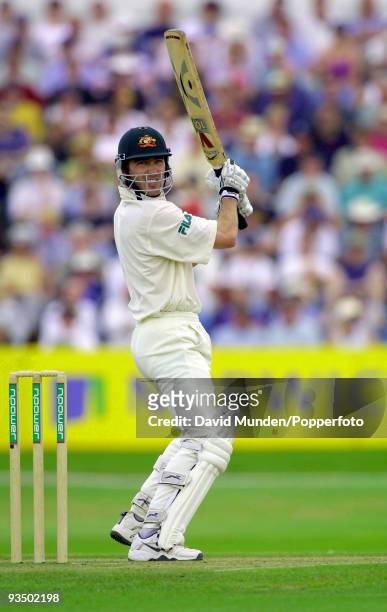 Australian batsman Damien Martyn cuts a ball from England's Andrew Caddick to the boundary for 4 runs during his innings of 118 runs on the second...