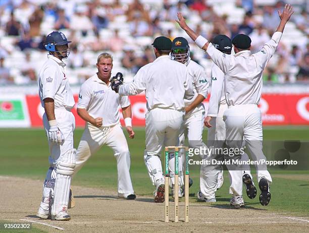Australia celebrate as England batsman Nasser Hussain is given out LBW to Shane Warne for 2 runs during their second innings on the fifth day of the...