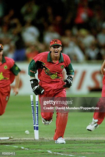 Zimbabwe wicketkeeper Andy Flower celebrates after running out England batsman Mark Ealham for 2 during the Standard Bank International Day/Night one...