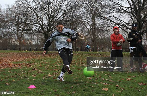 Luke McAlister takes a soccer penalty during the All Blacks recovery games session held in Hyde Park on November 30, 2009 in London, England.