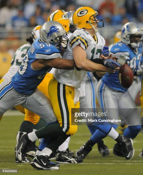 Julian Peterson of the Detroit Lions forces a fumble while sacking Aaron Rodgers of the Green Bay Packers during the game at Ford Field on November...