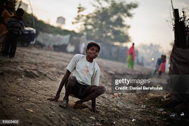 Fifteen year old Sachin Kumar crawls on his hands and knees as he travels to play a game of cricket in a slum near the site of the deserted Union...