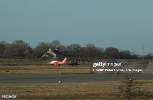 Red Arrows jet and Hawk jets on the tarmac at RAF Mona in north Wales, after another of the Red Arrows crashed nearby at RAF Valley.