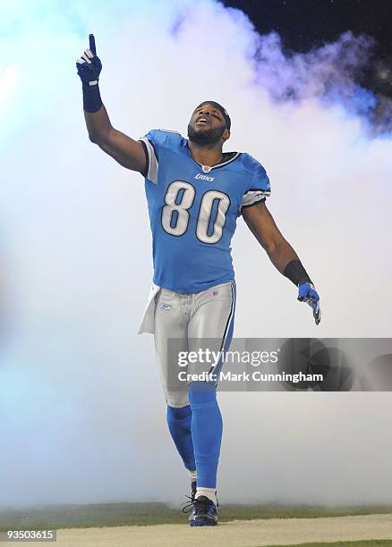 Bryant Johnson of the Detroit Lions points into the air during player introductions before the game against the Green Bay Packers at Ford Field on...