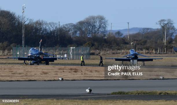 British Royal Air Force Hawk jets sit on the tarmac at RAF Mona air base in Anglesey, north Wales on March 20, 2018. A British military jet used in...