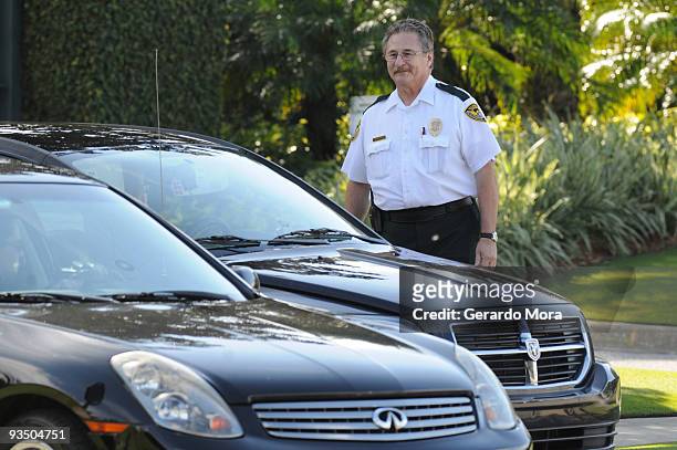 Security guard watches from the gate of the Isleworth community, which is home to Tiger Woods on November 30, 2009 in Windermere, Florida. Tiger...
