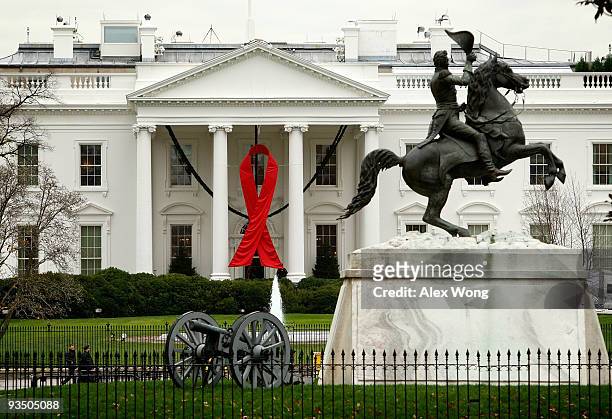 Red ribbon is hung at the North Portico of the White House to mark the coming of World AIDS Day November 30, 2009 in Washington, DC. The White House...