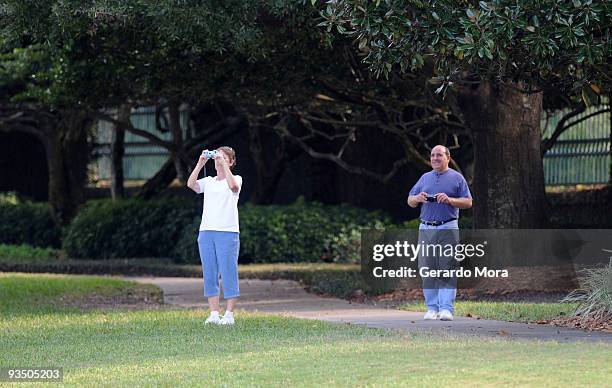 People take pictures from the gate of the Isleworth community, which is home to Tiger Woods, on November 30, 2009 in Windermere, Florida. Tiger Woods...