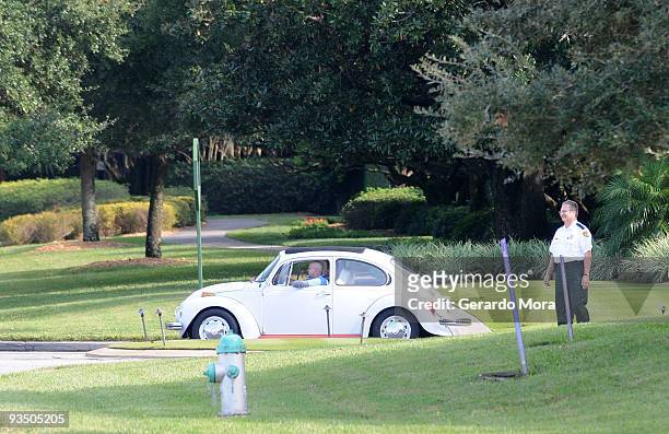 Security guard watches from the gate of the Isleworth community, which is home to Tiger Woods, on November 30, 2009 in Windermere, Florida. Tiger...