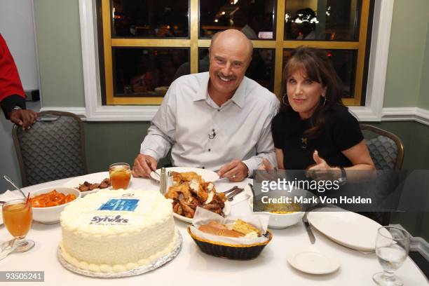 Dr. Phil McGraw and Robin McGraw enjoy dinner at Sylvia's Soulfood in Harlem while they celebrate the launch of the 8th Season of Dr. Phil on Sept 14...