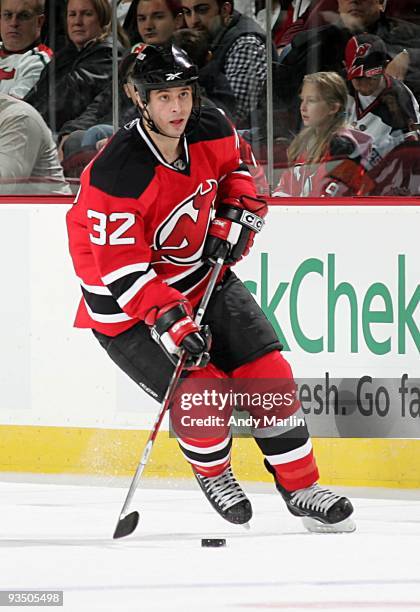 Matthew Corrente of the New Jersey Devils plays the puck against the Ottawa Senators during their game at the Prudential Center on November 25, 2009...