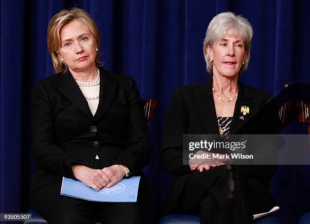 Secretary of State Hillary Rodham Clinton and Secretary of Health and Human Services Kathleen Sebelius participate in a news conference on the AIDS...