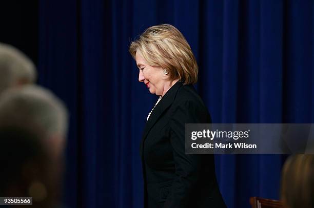 Secretary of State Hillary Rodham Clinton walks away after speaking at a news conference on the AIDS virus with Secretary of Health and Human...