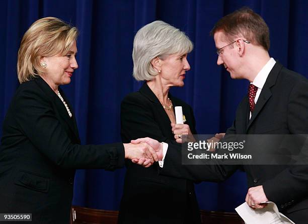 Secretary of State Hillary Rodham Clinton , Secretary of Health and Human Services Kathleen Sebelius and Jeffrey Crowley Director of the Office of...