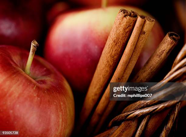 empire apples and cinnamon sticks - cinnamon stock pictures, royalty-free photos & images