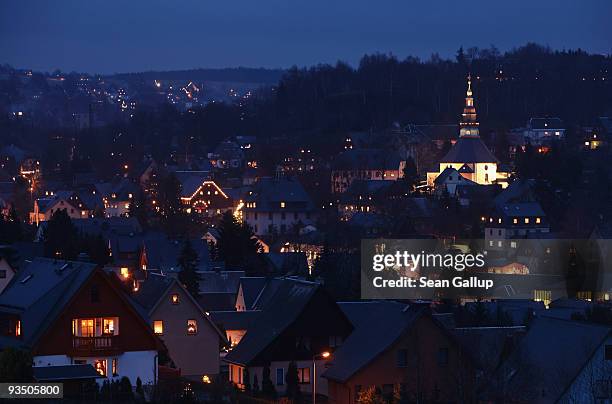 Twilight descends over houses and the town church on November 30, 2009 in Seiffen, Germany. Seiffen, located in eastern Germany close to the Czech...