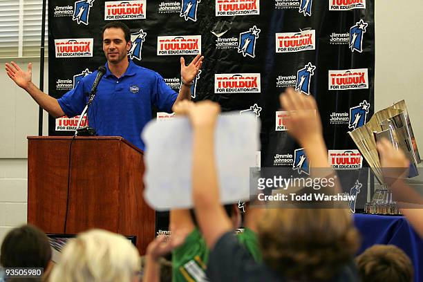 Four-time NASCAR Sprint Cup Champion Jimmie Johnson, driver of the Lowe's Chevrolet, speaks to students at his alma mater, Crest Elementary School on...
