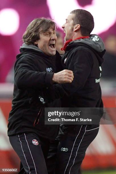 Head coach Marco Kurz and goalkeeper coach Gerald Ehrmann of Kaiserslautern celebrate after the Second Bundesliga match between 1. FC Kaiserslautern...