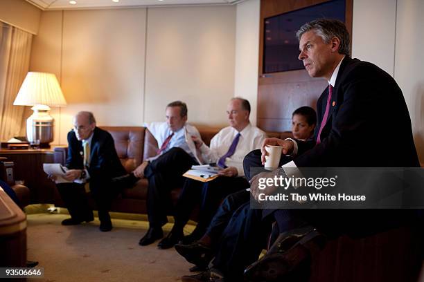 In this handout provided by the White House, U.S. Ambassador to China Jon Huntsman listens as President Barack Obama meets with advisors NSC Senior...