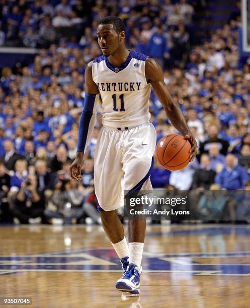 John Wall of the Kentucky Wildcats dribbles the ball during the game against the Sam Houston State Bearkats at Rupp Arena on November 19, 2009 in...