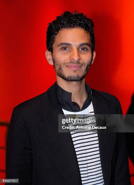 French Actor Mehdi Dehbi poses as he attends La Folle Histoire d'Amour de Simon Eskenasy premiere at Cinema Gaumont Capucine on November 30, 2009 in...